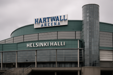 Kuvassa Harwall areena eli nykyinen Helsinki-Halli. Hallin värimaailma on vihreää ja harmaata. Hallin rakenteet ovat betonia.