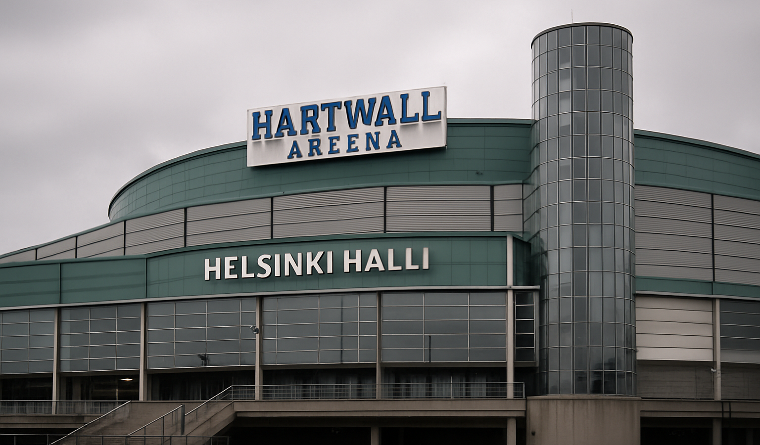 Kuvassa Harwall areena eli nykyinen Helsinki-Halli. Hallin värimaailma on vihreää ja harmaata. Hallin rakenteet ovat betonia.